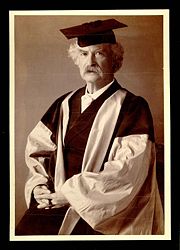 Mark Twain in his gown (scarlet with grey sleeves and facings) for his DLitt degree, awarded to him by Oxford University.