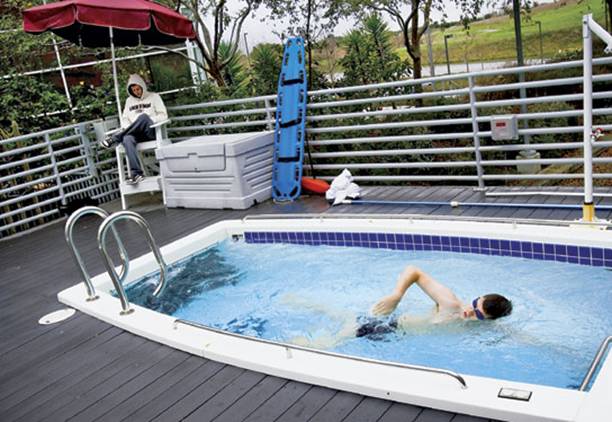 TIME Photo Essay: Life in the Googleplex: Inside Google Headquarters

. A lifeguard sits on duty as a Google employee works out in one of two swim-in-place pools that the company maintains at its Mountain View, California, headquarters.. PHOTO BY EROS HOAGLAND / REDUX FOR TIME